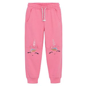 Pink jogging pants with unicorn print on the knees