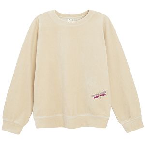 Ecru sweatshirt with gold threading around the neck and wrists