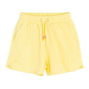 Yellow sports shorts with cord on the waist