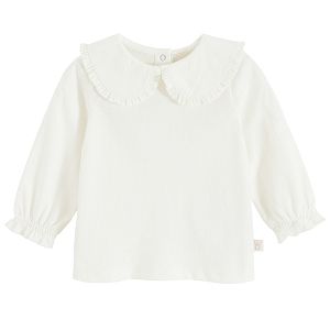 White long sleeve blouse with round collar and elastic around wrists